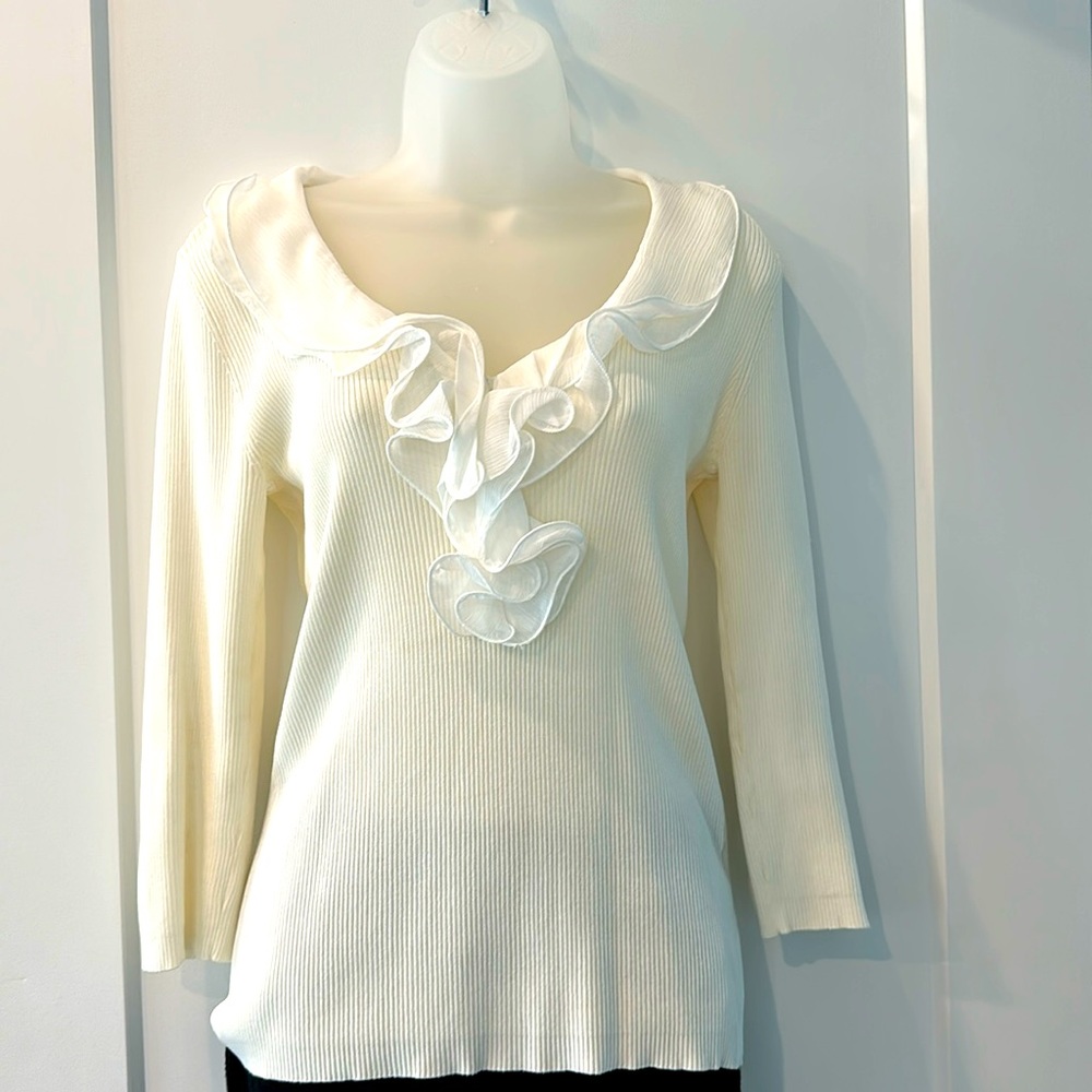 Cream colored 3/4 sleeve ruffle V neck top